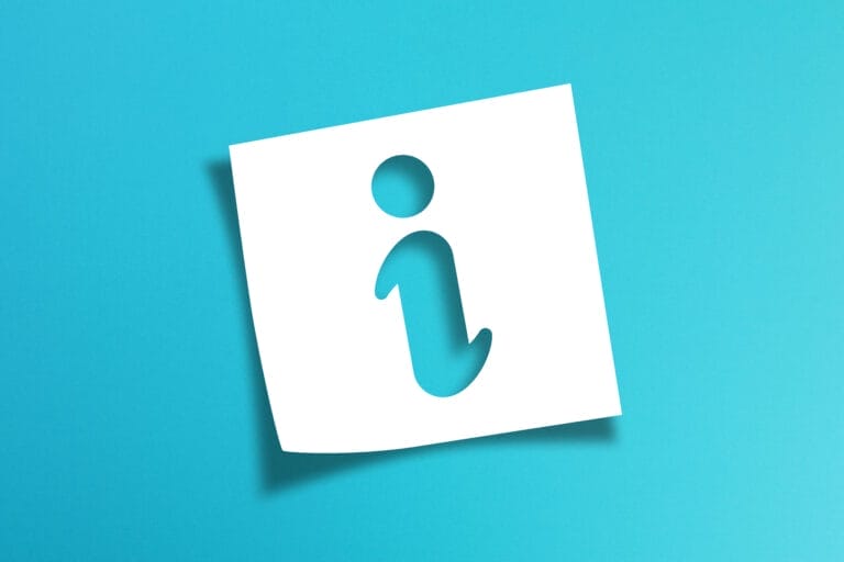 Note paper with information sign on blue background